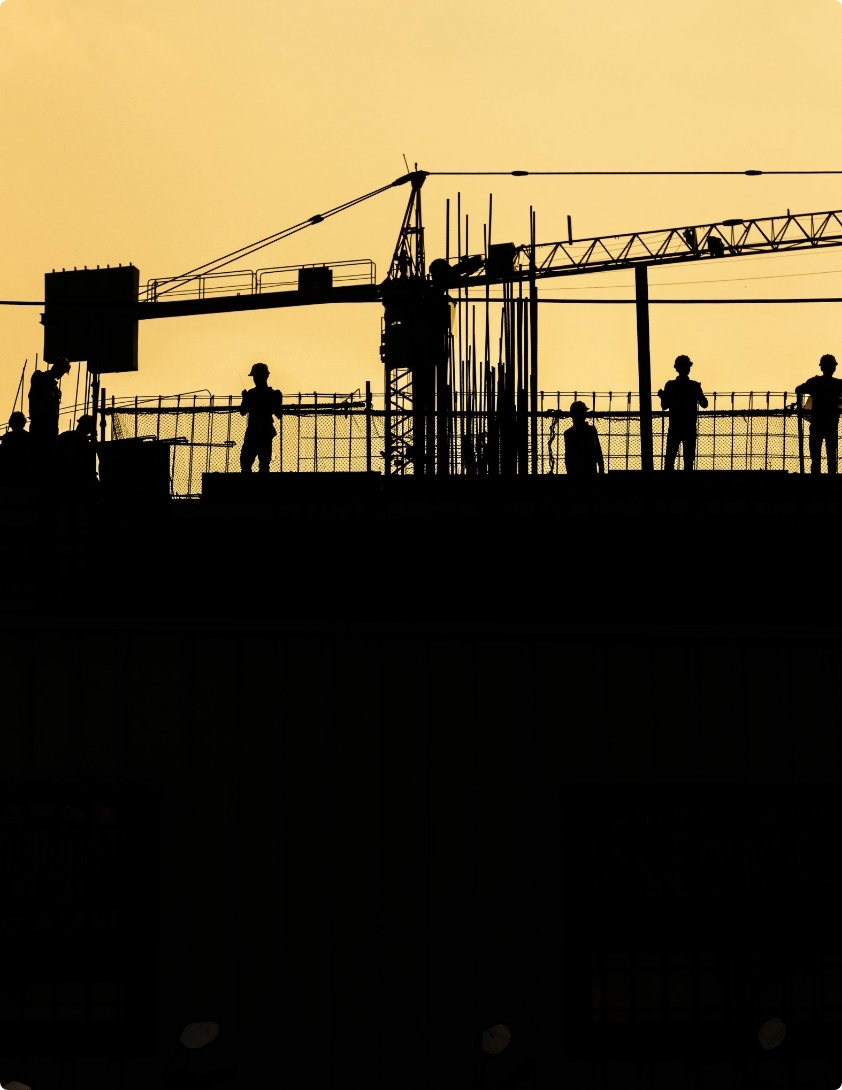 A silhouette of a city under construction